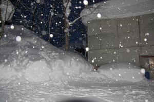 Snow plough piles the size of houses